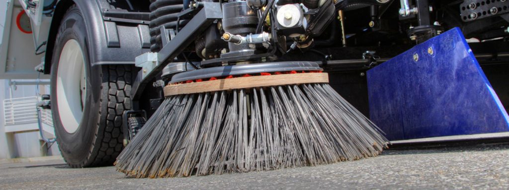 Street Sweeping Services in the Grand Rapids, Michigan area-image of street sweeper truck Parking Lot Sweeping Services