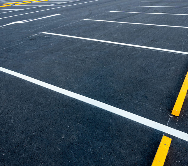 Line striping services in the Grand Rapids, Michigan area-Freshly Painted parking lot striping Image